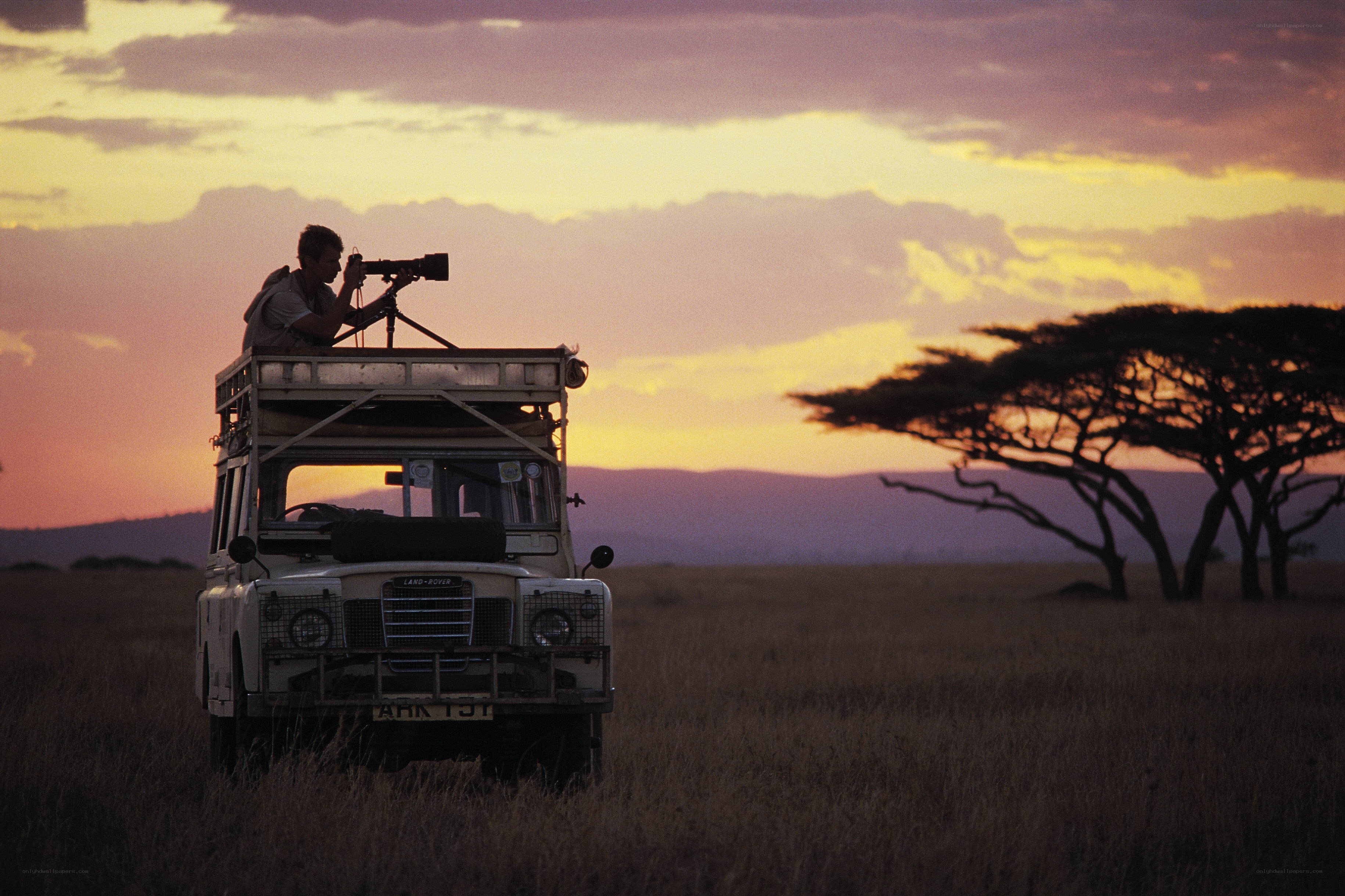 Photographer on safari at sunset