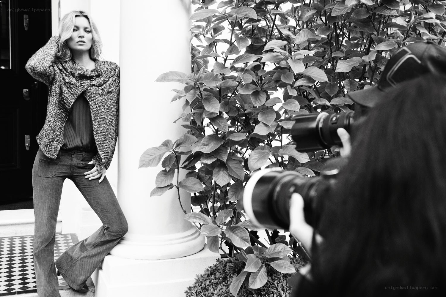 Photographer shooting a model
