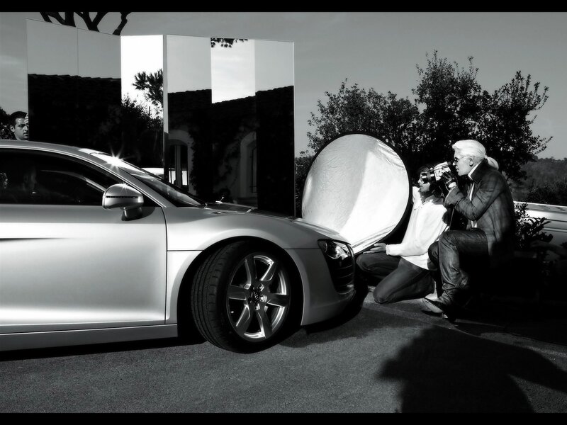 Photographer shooting car photos
