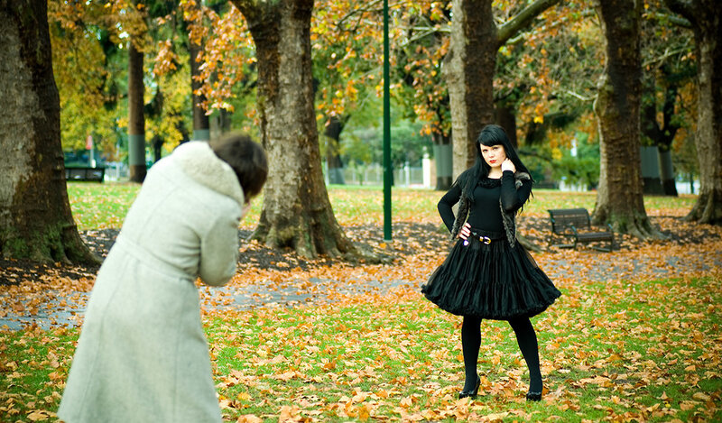 Photographer shooting in autumn park