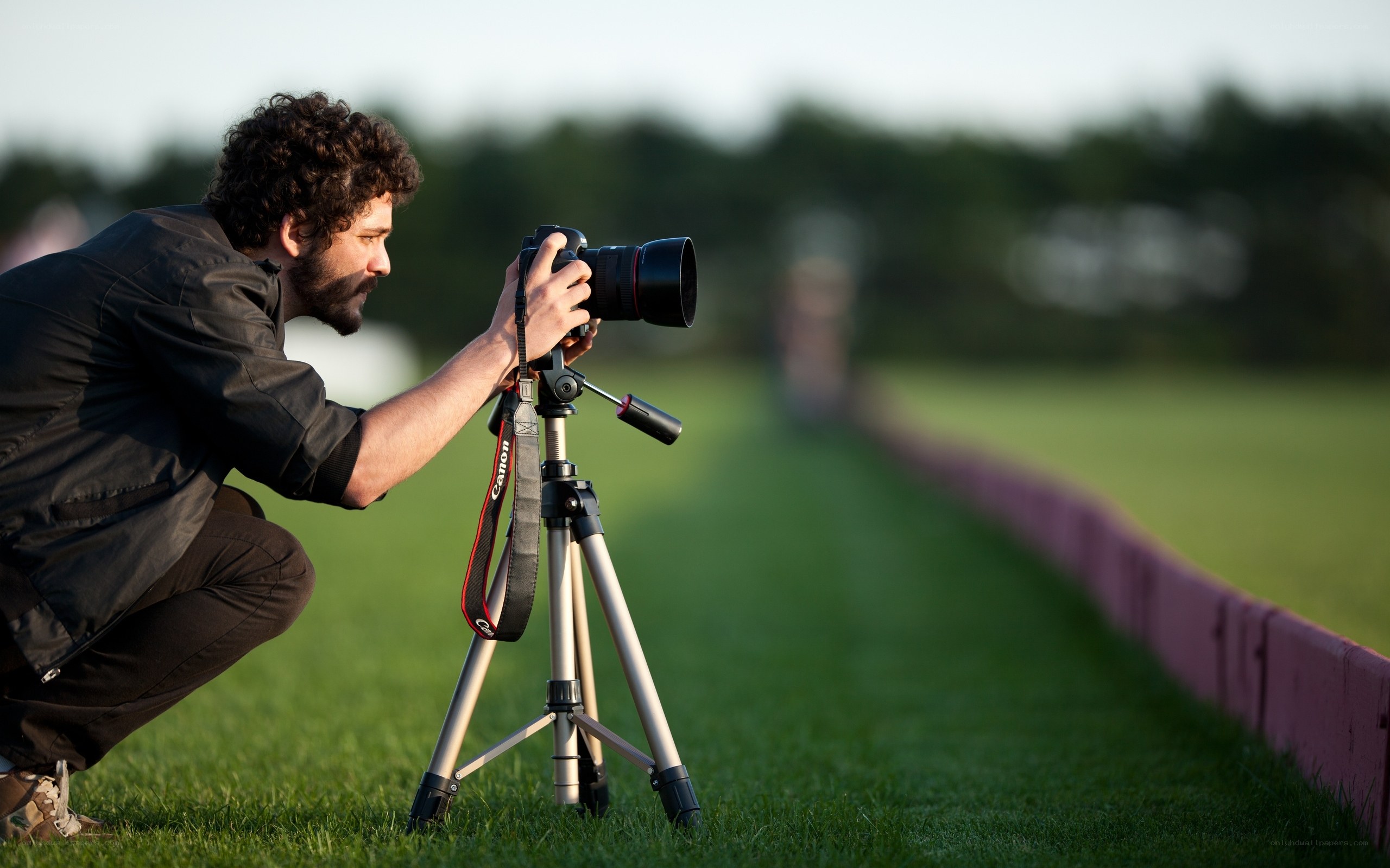 photographer using tripod outdoors