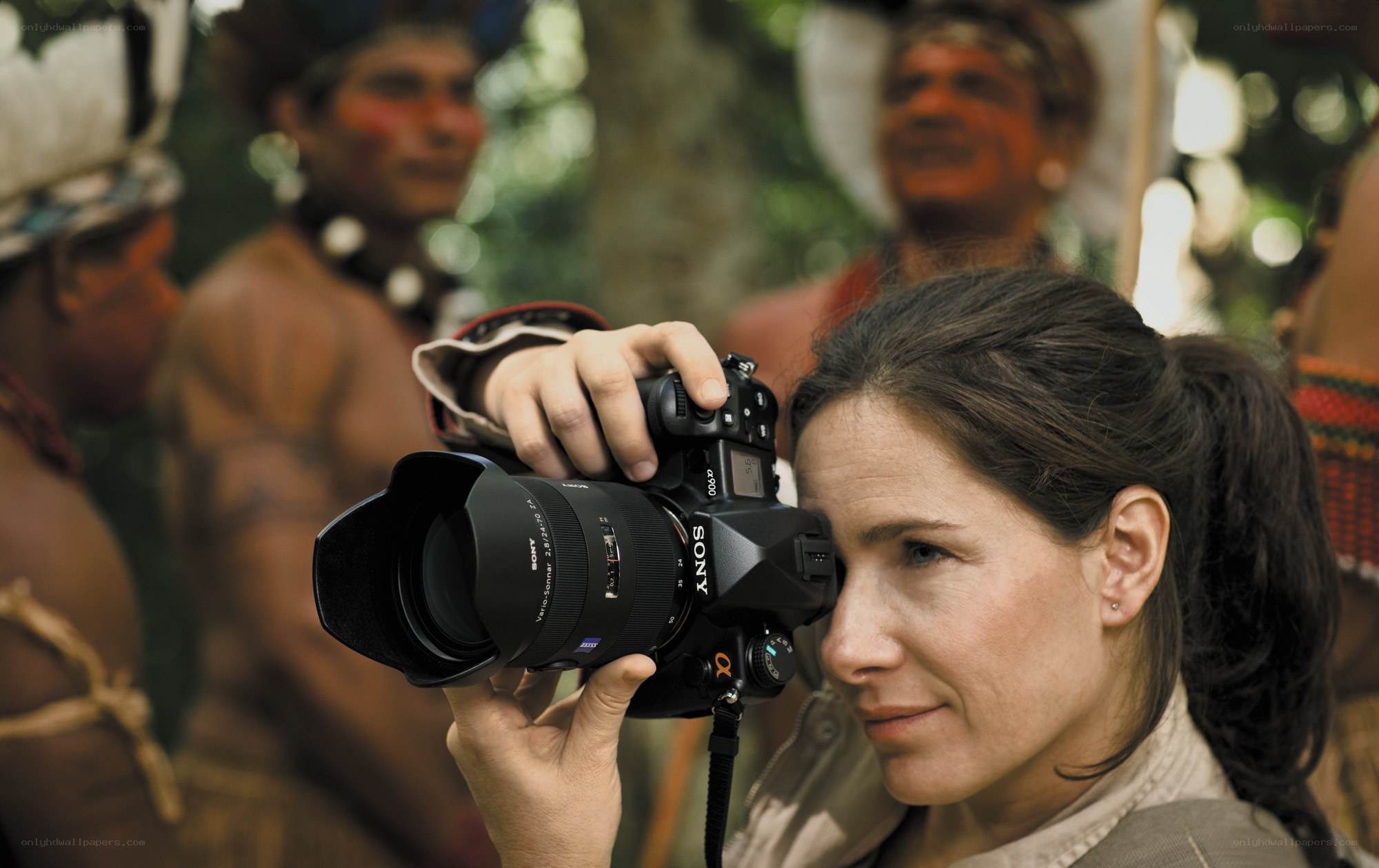 Photographer with camera in jungle