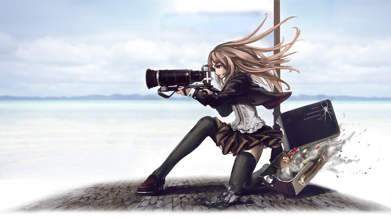 Photographer with camera on beach