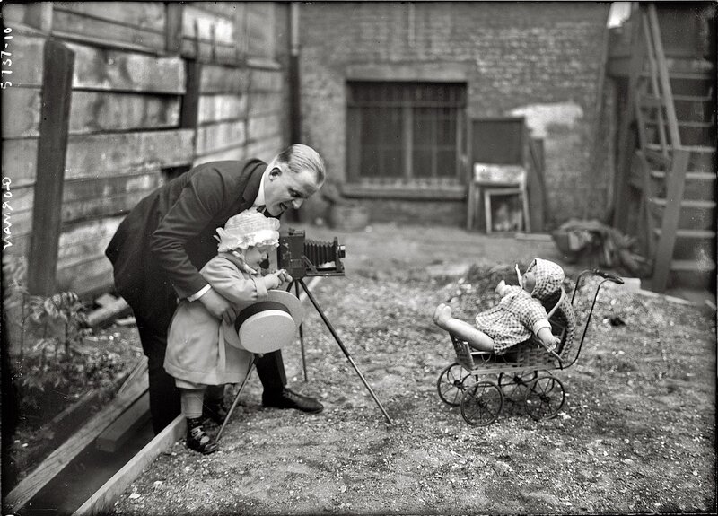 Photographer with child in courtyard