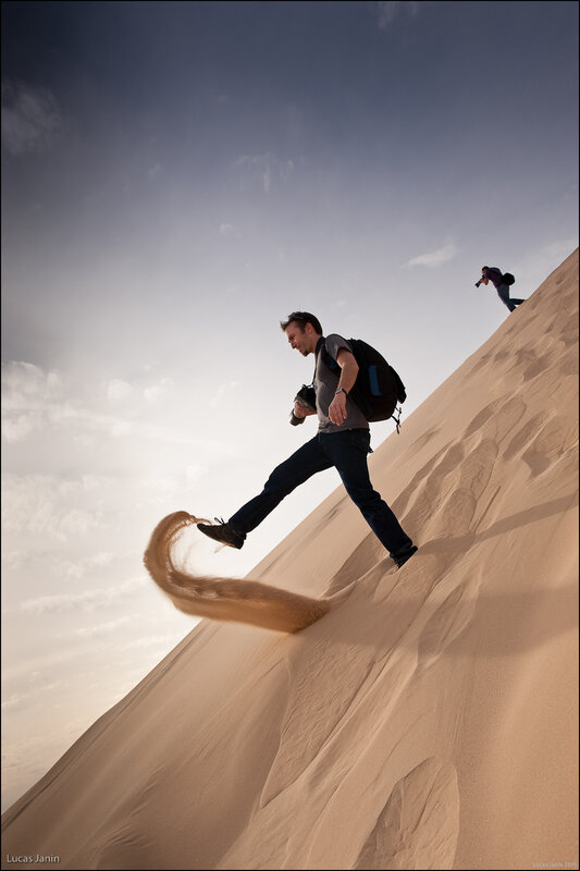 Photographers on a sand dune