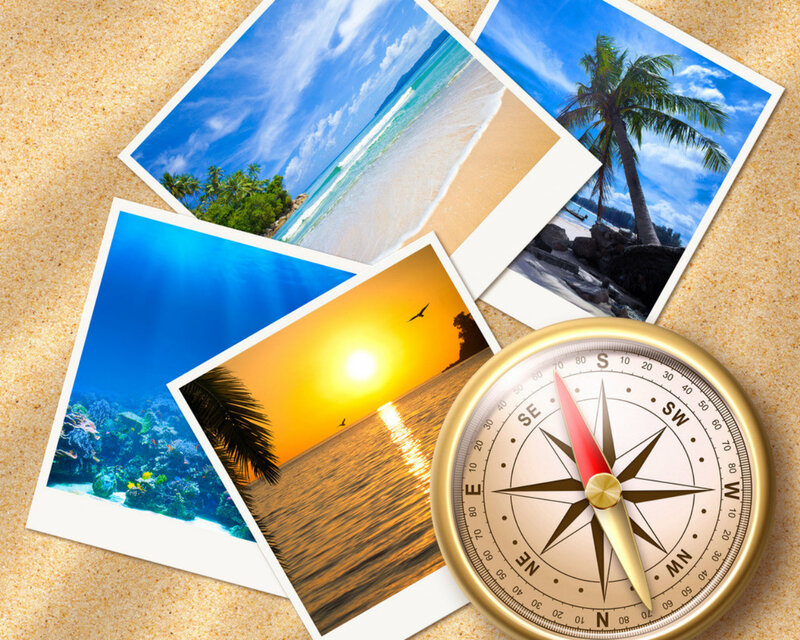 Photos and Compass on Sand