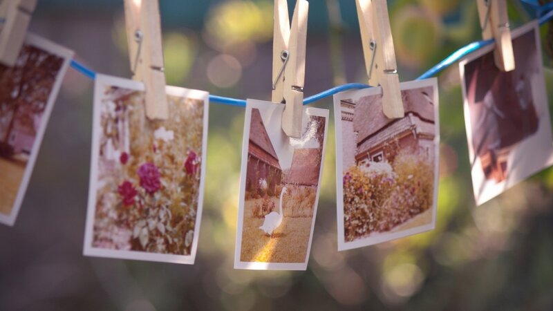 Photos hanging on a clothesline