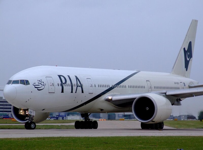 PIA Airplane on Runway — White, Neutral