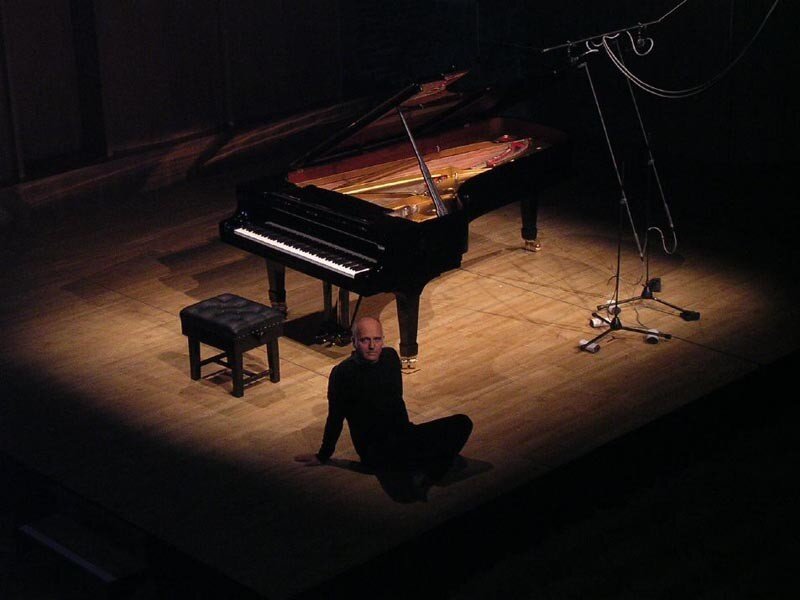 Pianist on stage with grand piano
