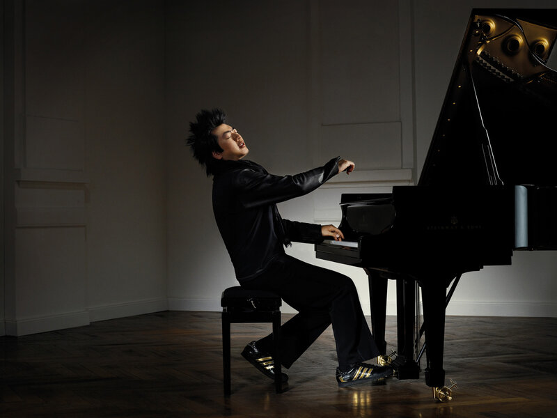 Pianist playing grand piano