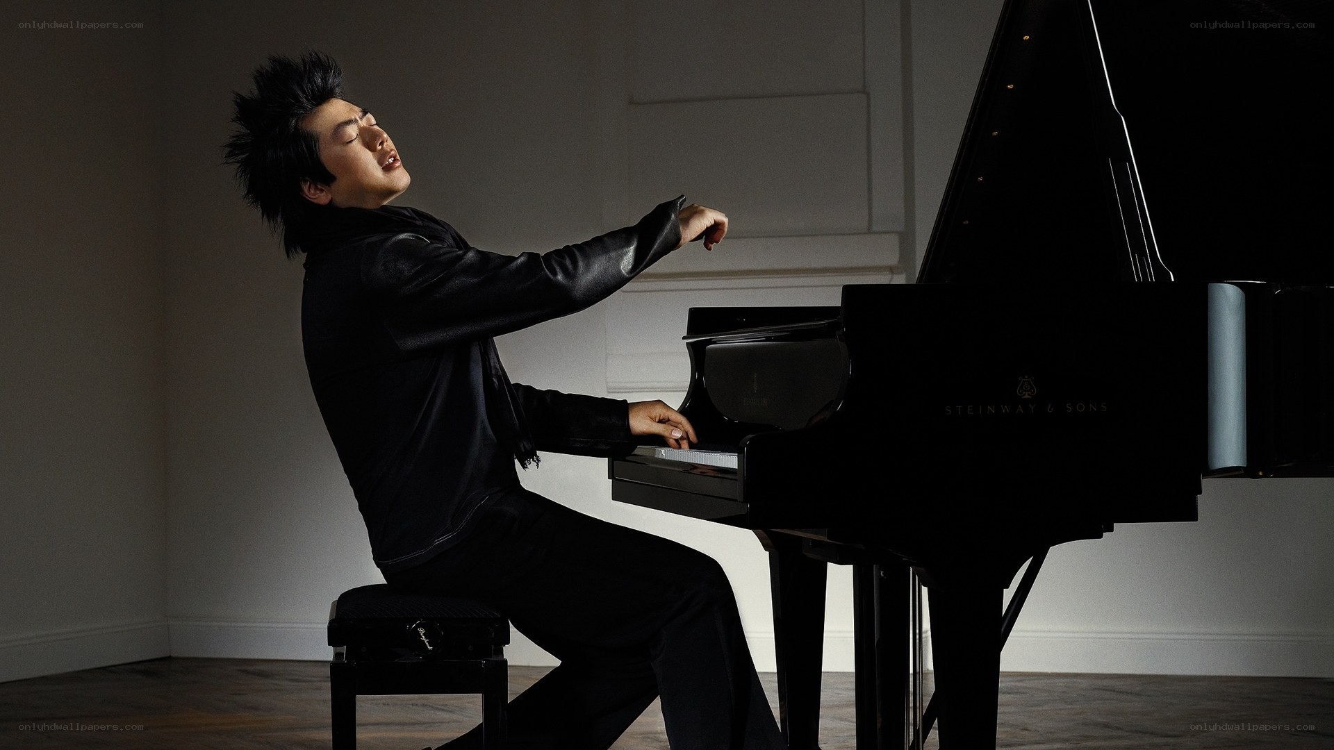 pianist playing grand piano