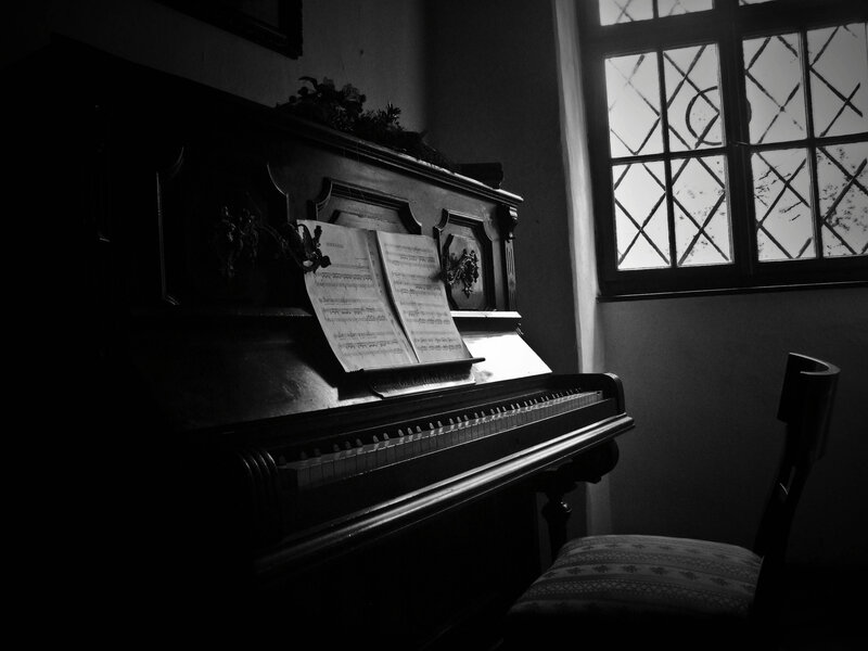 Piano in Dimly Lit Room