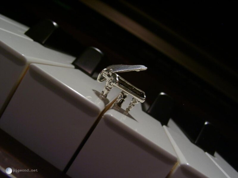 Piano key with miniature piano