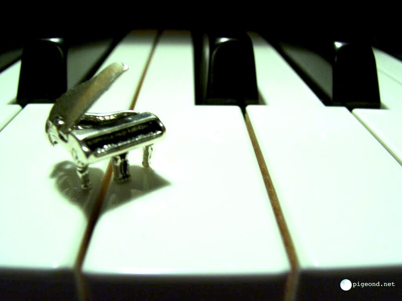 Piano key with miniature piano