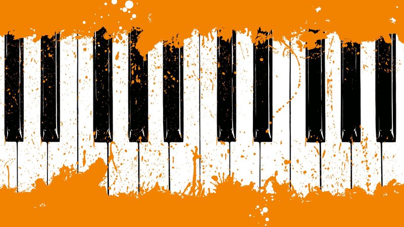 piano keys with orange splatter