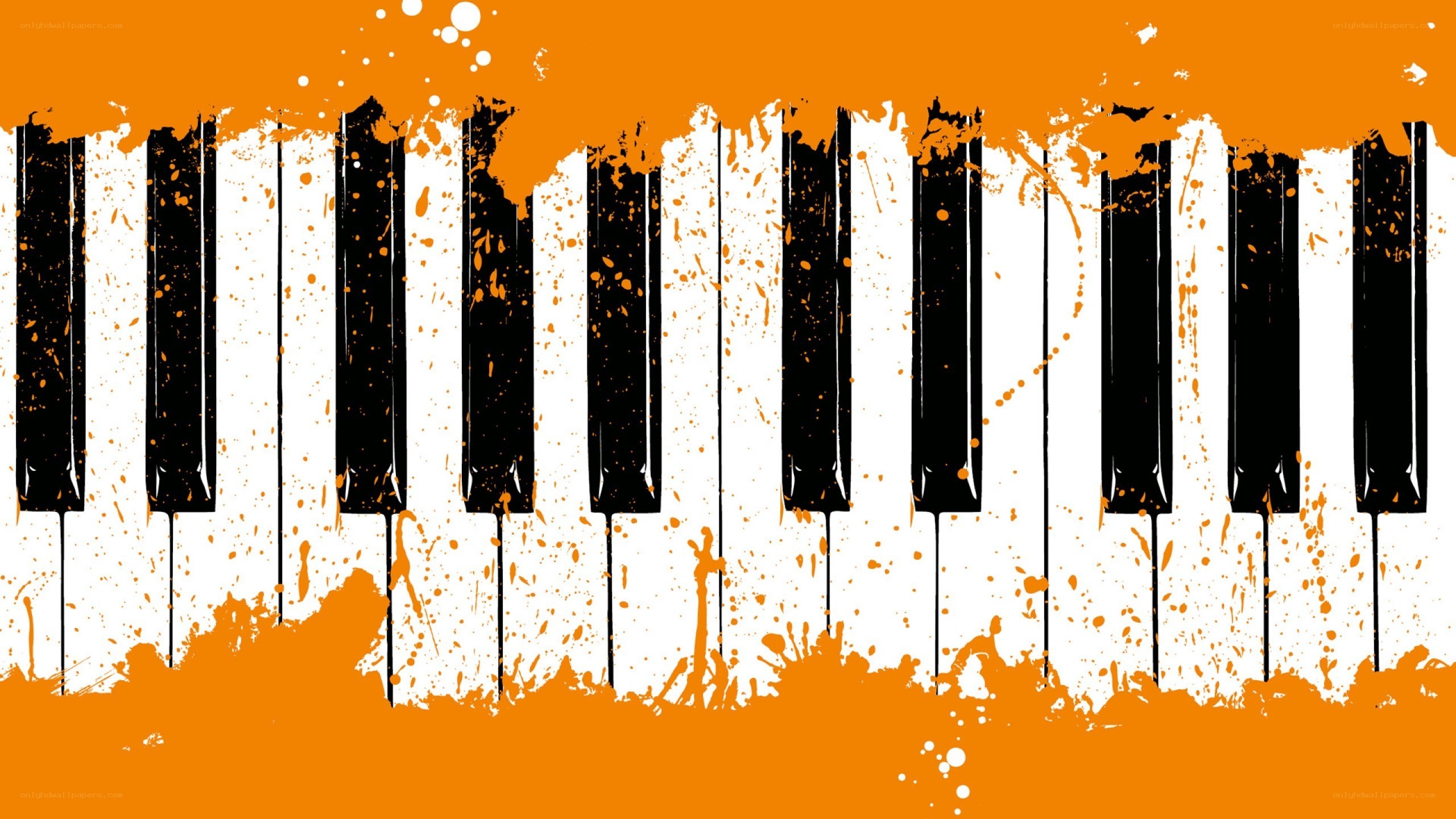 piano keys with orange splatter