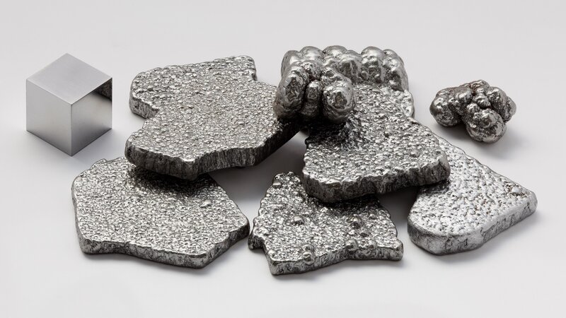 Pieces of metal on white surface