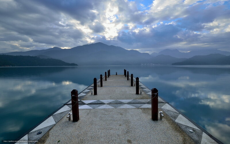 Pier at a misty lake