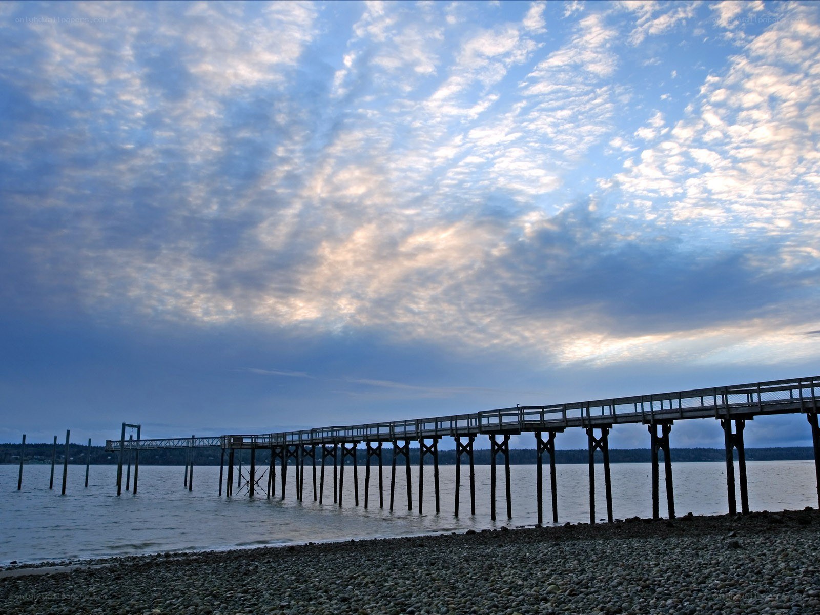 Pier at a pebble beach