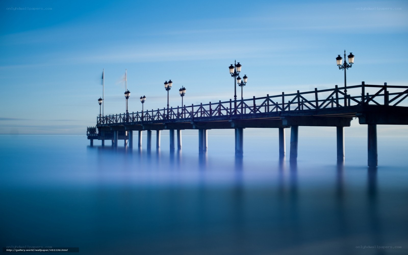 Pier at dawn with calm sea