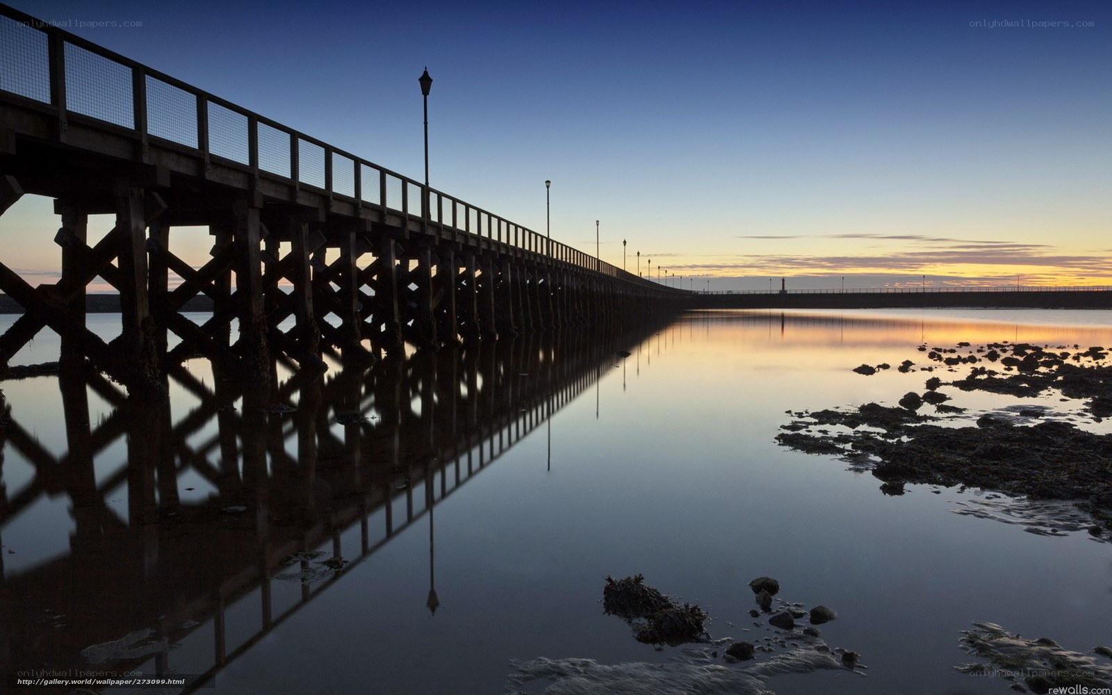 Pier at dawn with reflection