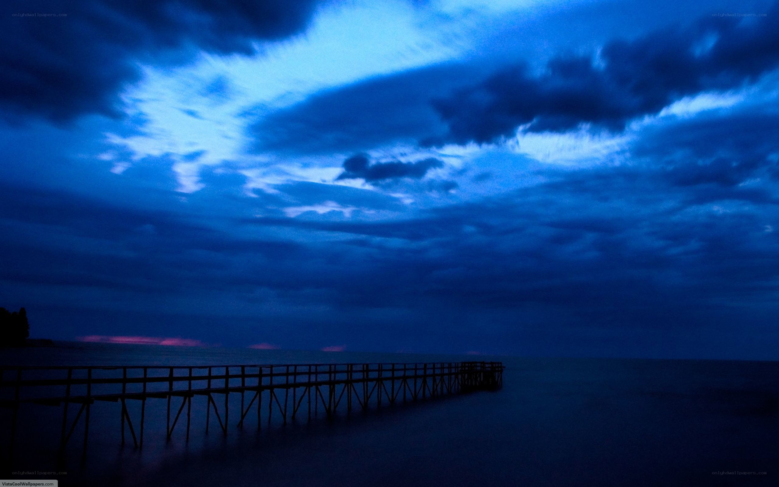 Pier at dusk with blue sky