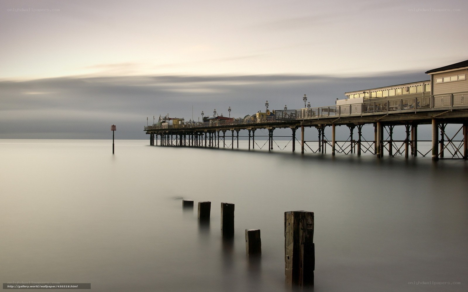 Pier at dusk with calm sea