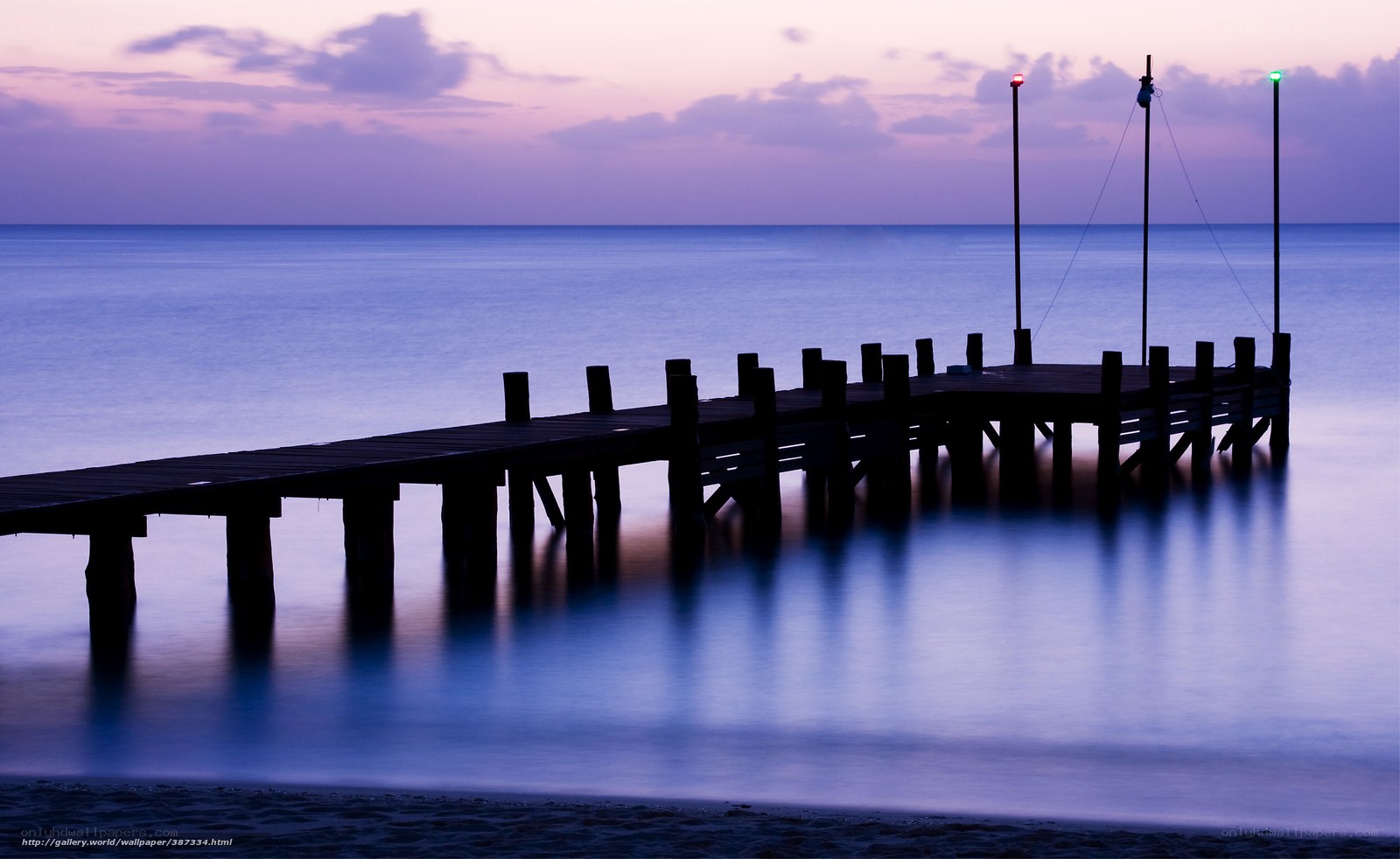 Pier at dusk with calm sea