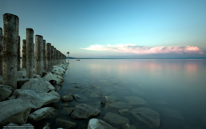 Pier at dusk with calm water
