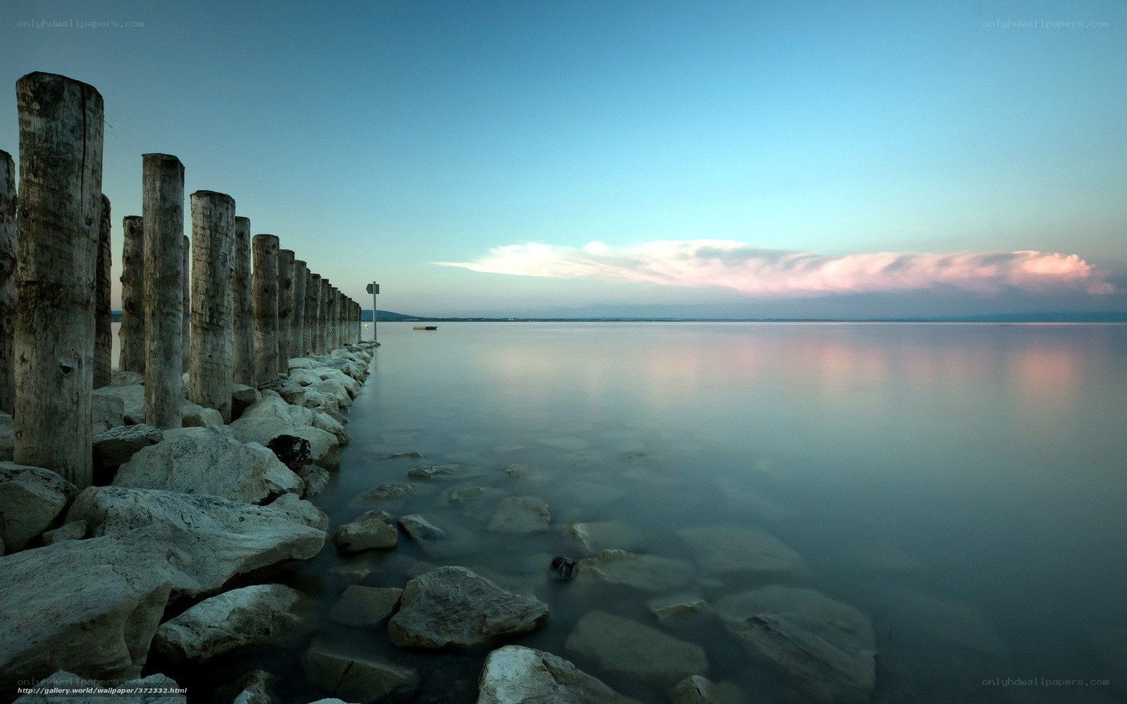 Pier at dusk with calm water