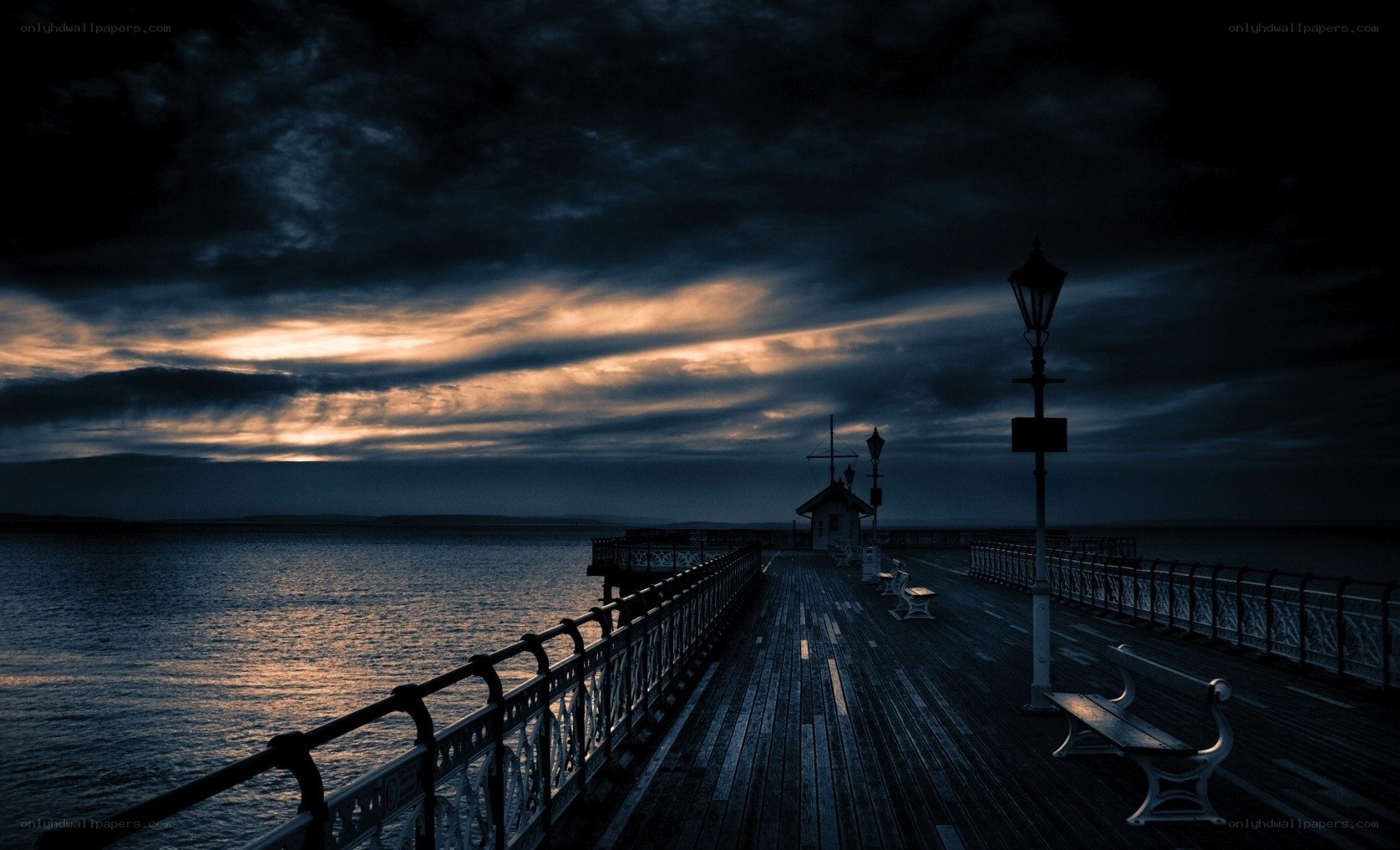 Pier at dusk with cloudy sky