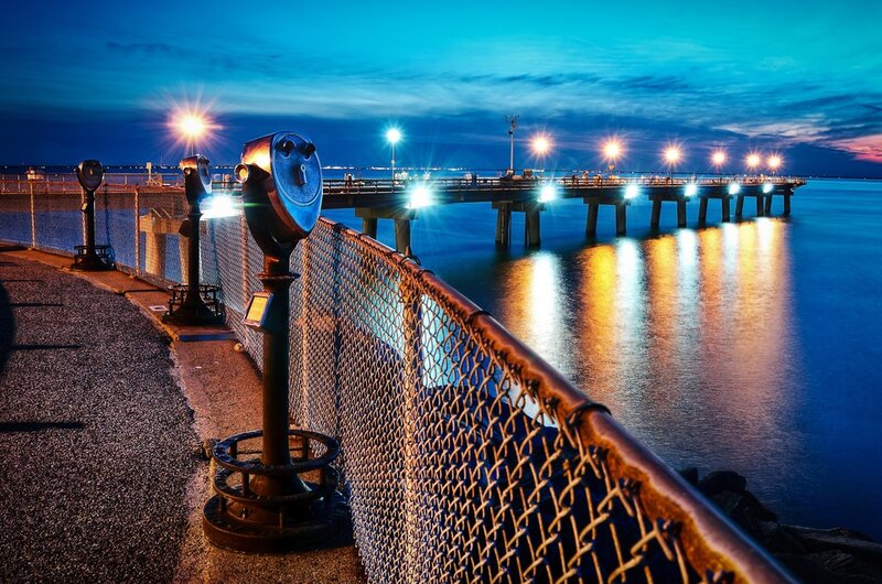 Pier at dusk with coin-operated binoculars