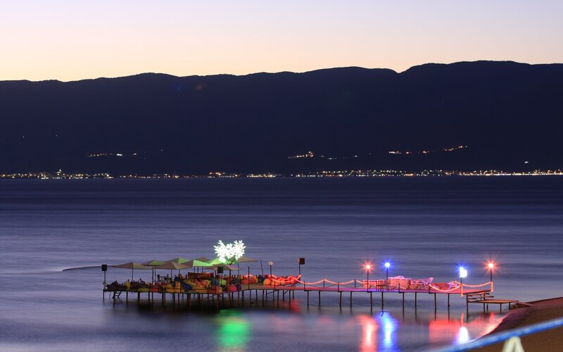 Pier at dusk with colorful lights