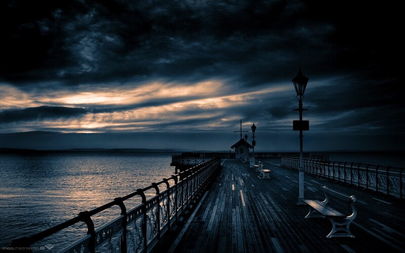 Pier at dusk with dramatic sky