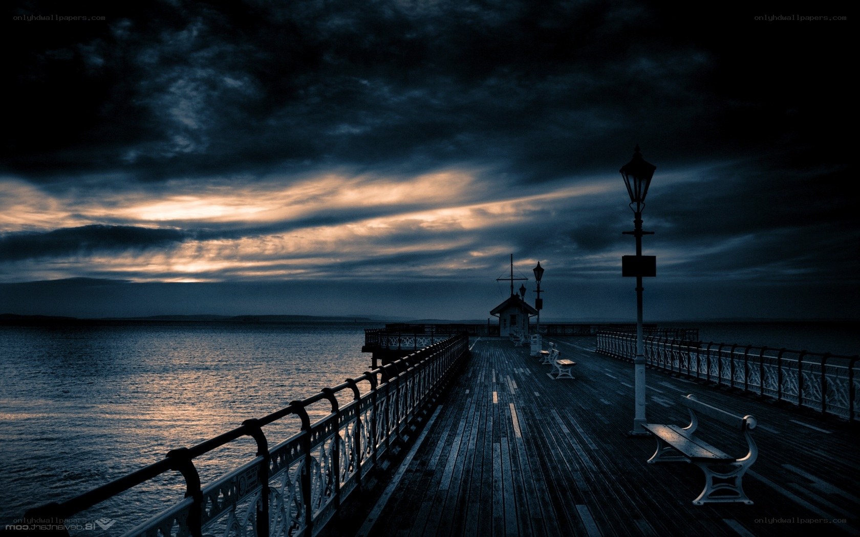 Pier at dusk with dramatic sky