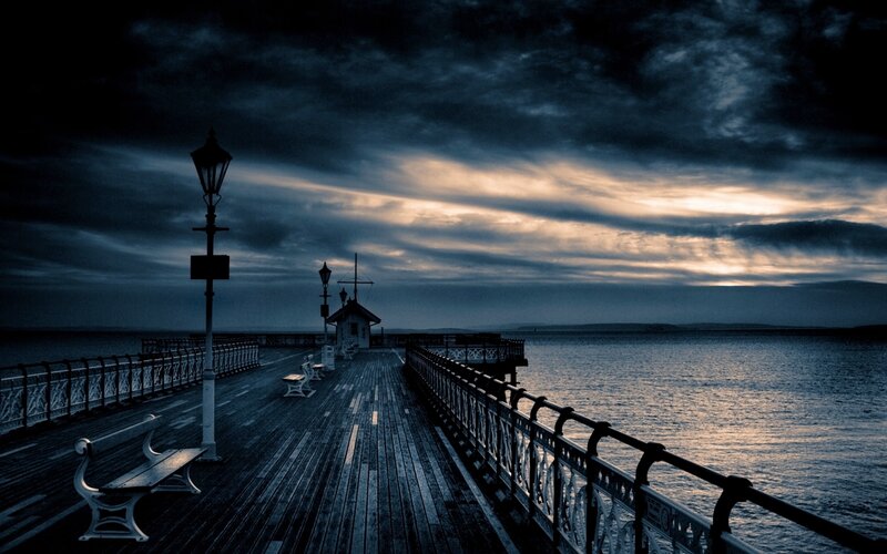 Pier at dusk with dramatic sky