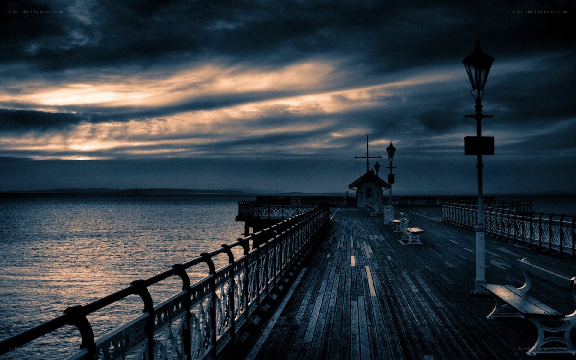 Pier at dusk with dramatic sky
