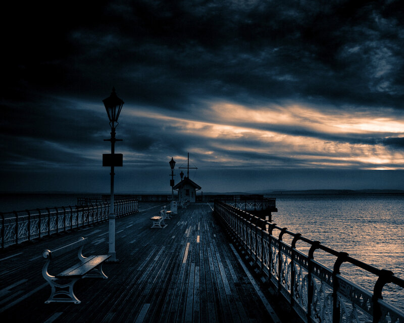 Pier at dusk with dramatic sky
