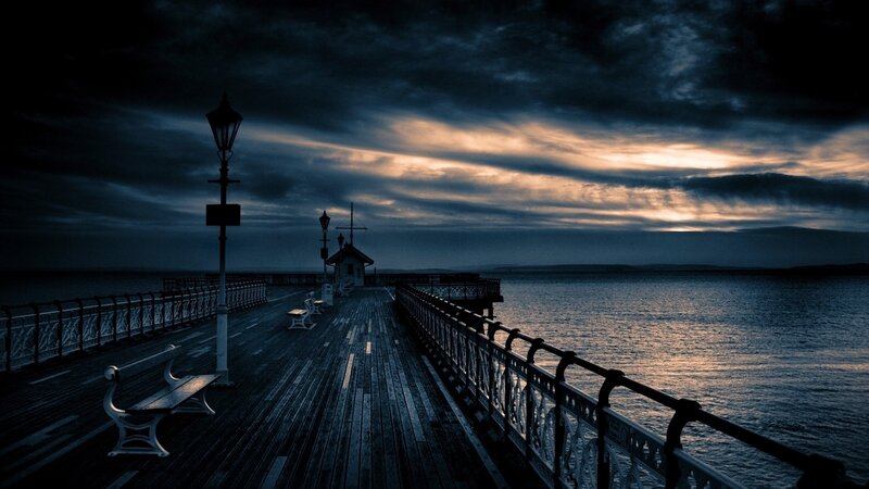 Pier at dusk with dramatic sky