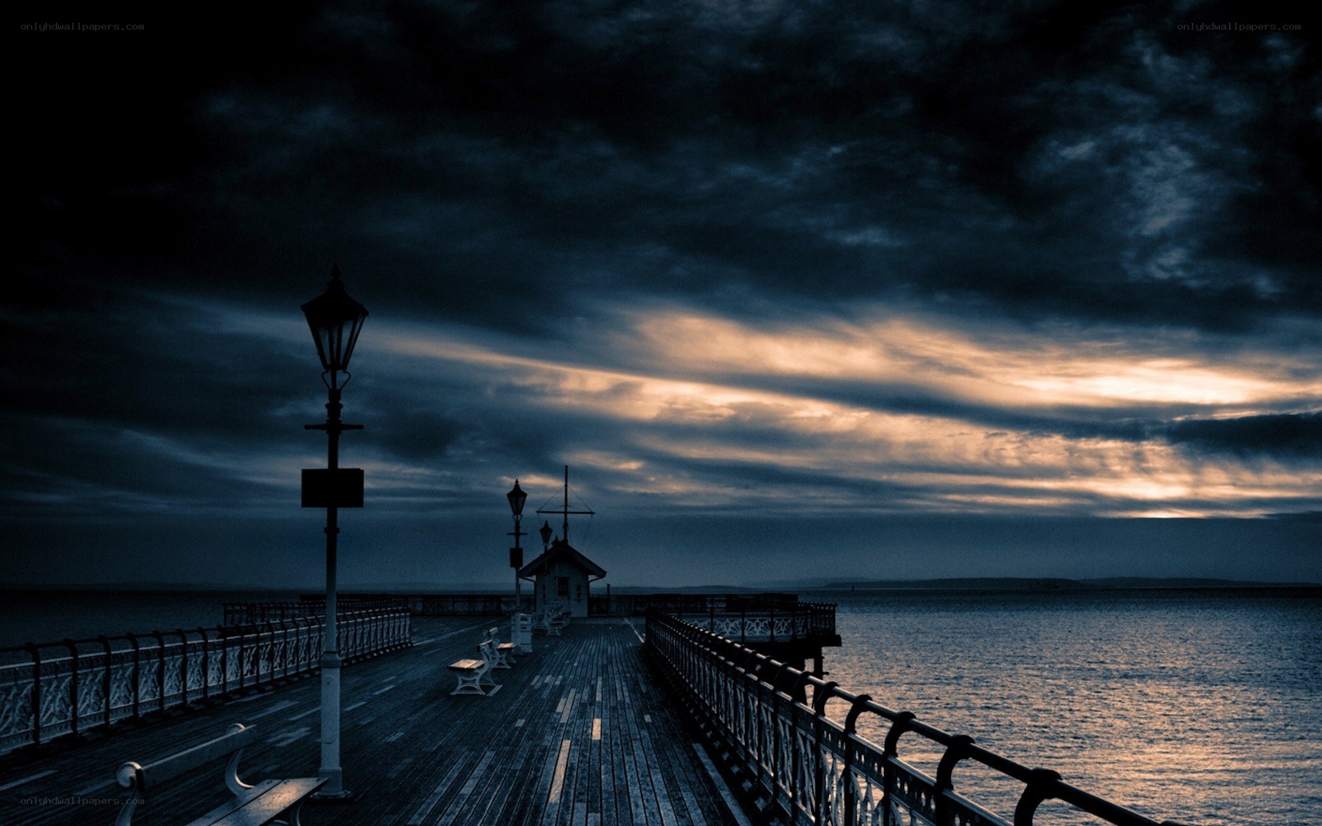 Pier at dusk with dramatic sky