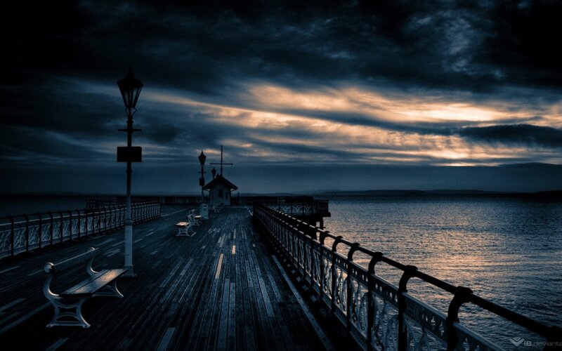 Pier at dusk with dramatic sky