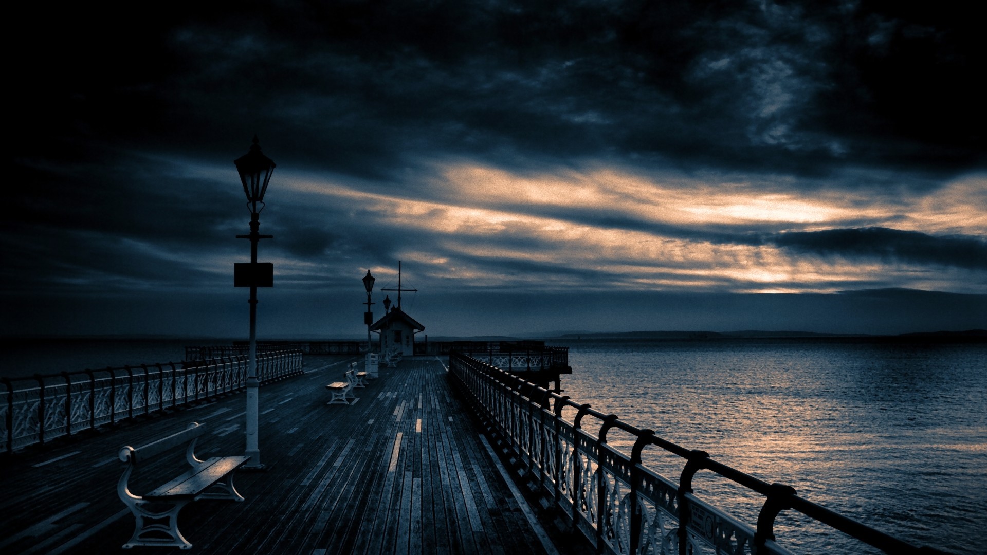 Pier at dusk with dramatic sky