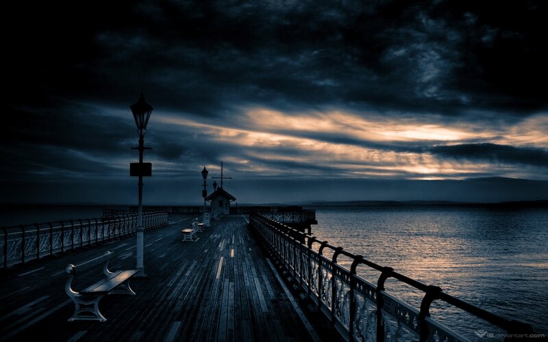 Pier at dusk with dramatic sky