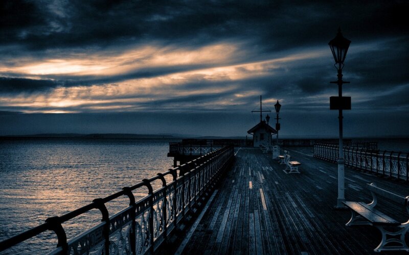 Pier at dusk with dramatic sky