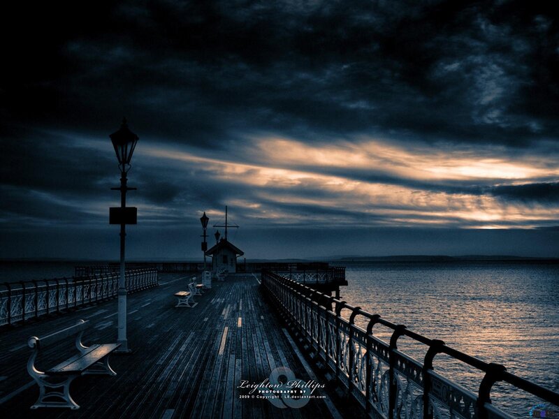 Pier at dusk with dramatic sky