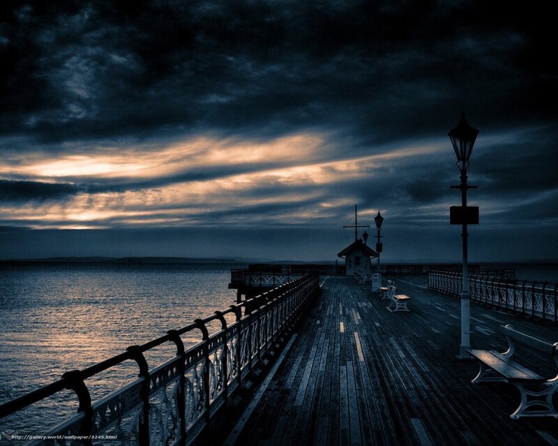 Pier at dusk with dramatic sky