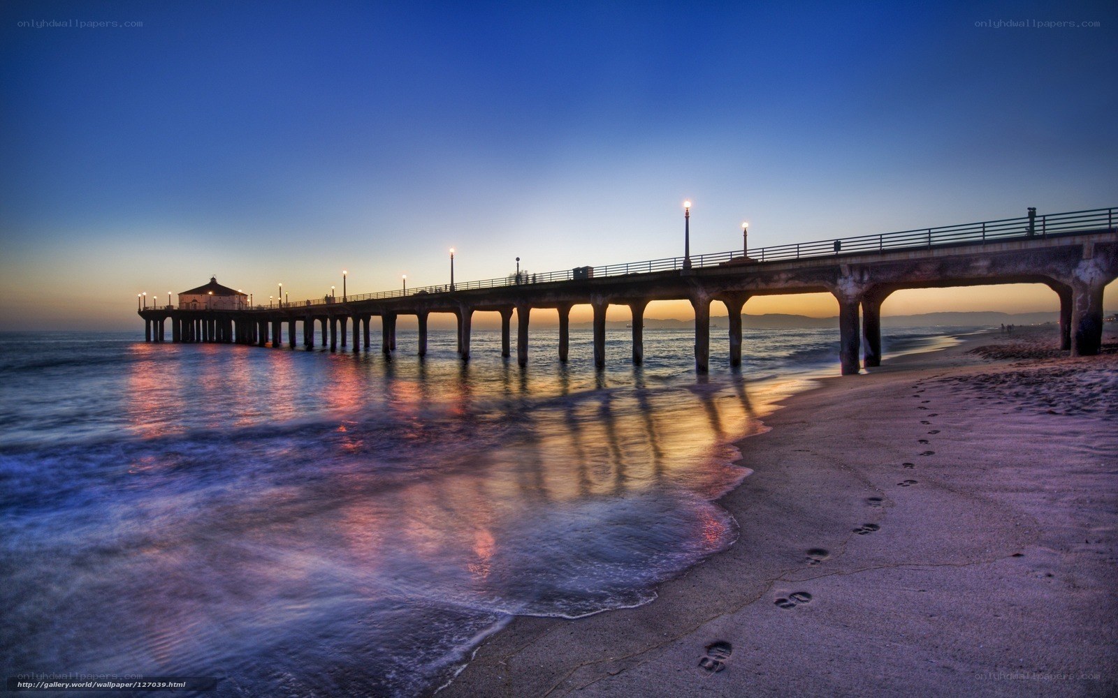 Pier at dusk with footprints