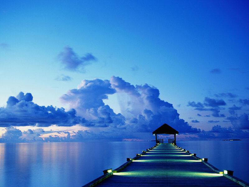 Pier at dusk with glowing lights