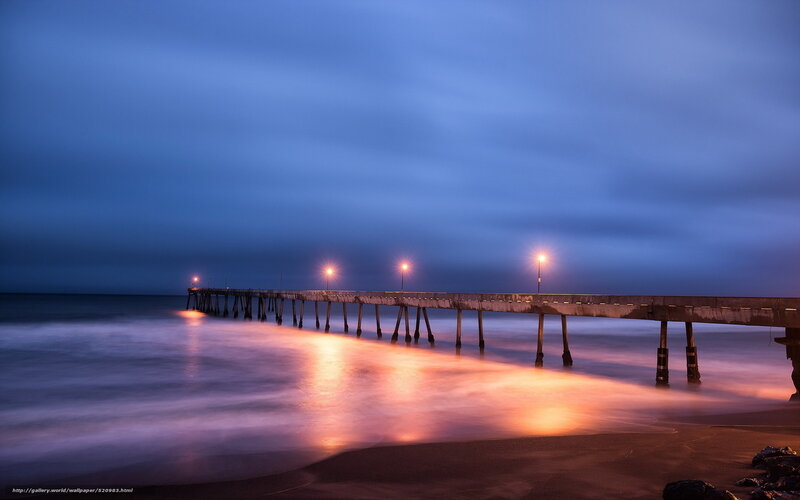 Pier at dusk with glowing lights