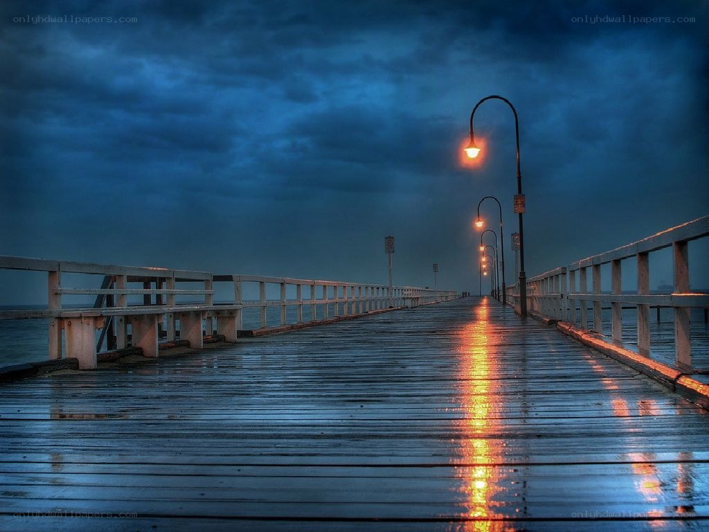 Pier at dusk with glowing lights